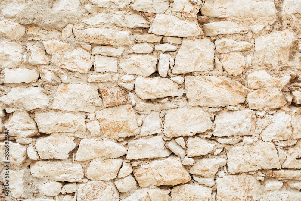 Texture of stone wall. Old building. Neutral background.