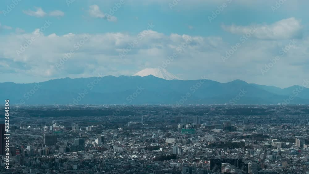 Tokyo areal view with Mount Fuji an background wonderful rolling clouds, zoom out , 4K time-lapse Tokyo areal view with Mount Fuji an background wonderful rolling clouds, zoom out , 4K time-lapse