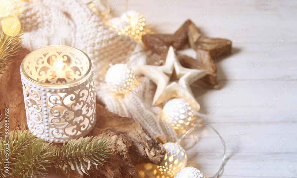 Cosy and soft winter background, knitted sweater and lights Cosy and soft winter background, knitted sweater and lights