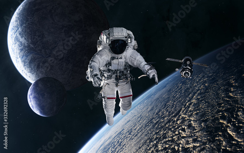 Fototapeta Naklejka Na Ścianę i Meble -  Astronaut, space station on the background of planets in deep space. Science fiction. Elements of this image furnished by NASA
