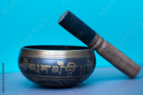 Tibetan singing bowl on a blue background  photo