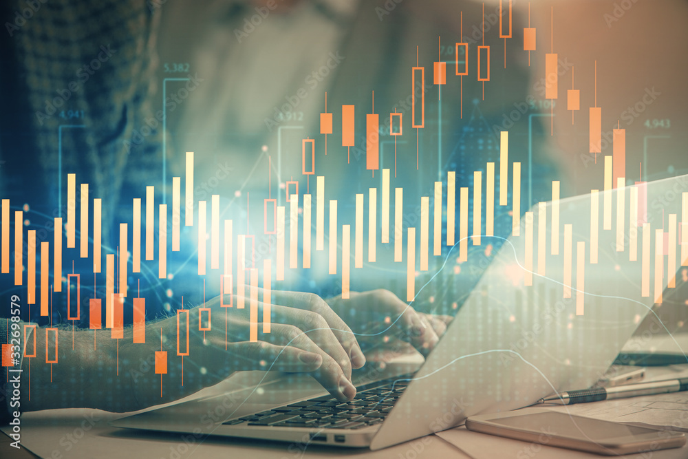 Double exposure of market chart with man working on computer on background. Concept of financial analysis. Double exposure of market chart with man working on computer on background. Concept of financial analysis.