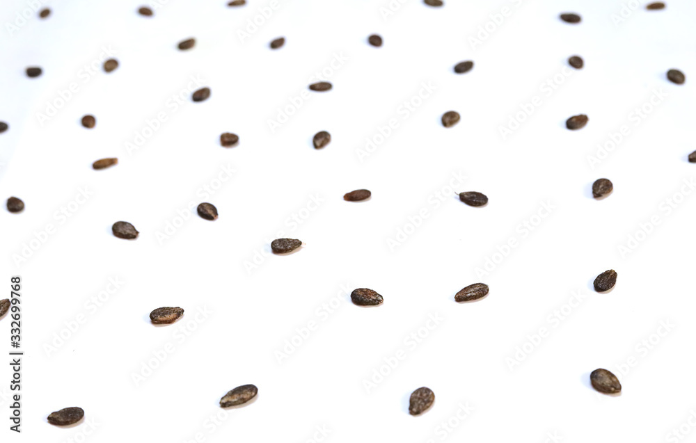 Multiple watermelon seeds, composition isolated over the white background, top view Multiple watermelon seeds, composition isolated over the white background, top view