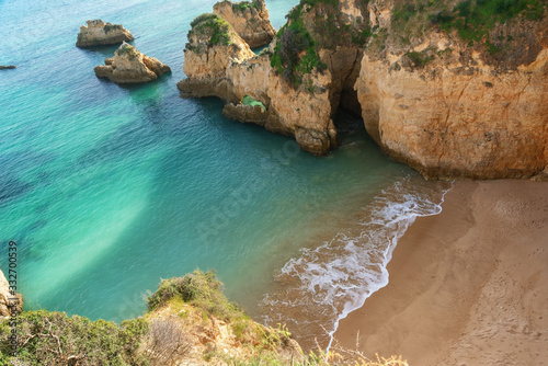 A beautiful bay landscape on the Portuguese beach of Boiao, a clear blue turquoise sea. Algarve