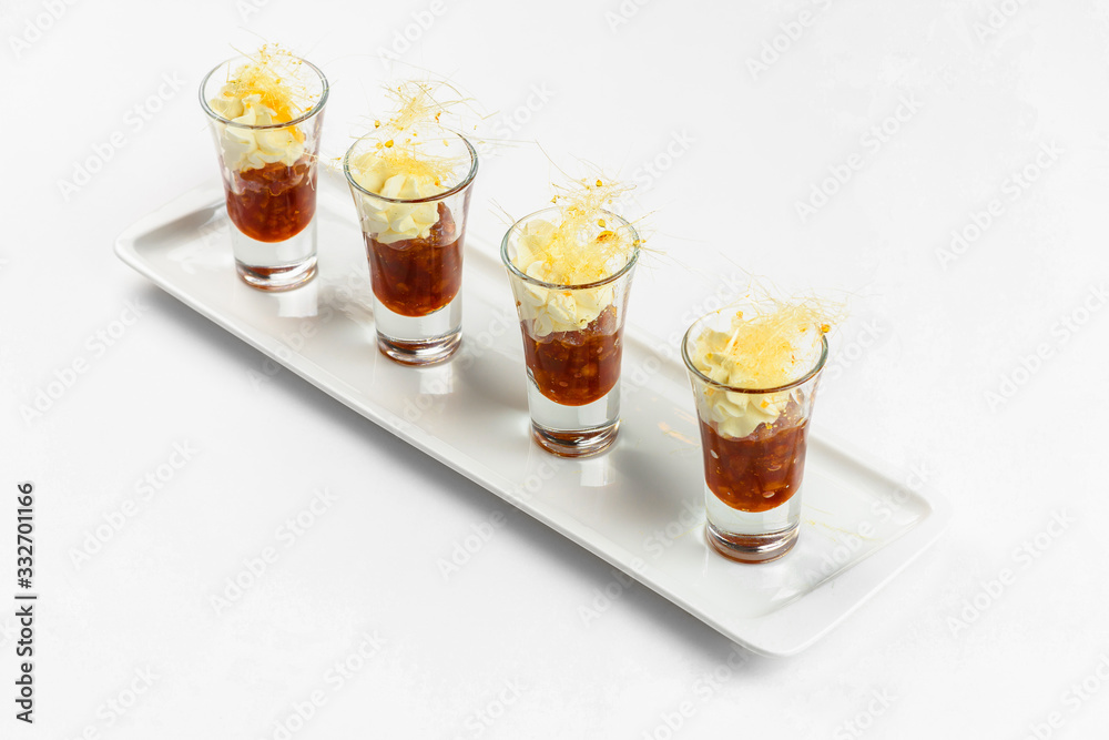 Sweet snacks in glass on white background. Catering service
