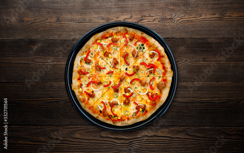 Food ingredients and spices for cooking mushrooms, tomatoes, cheese, onion, oil, pepper, salt, basil, olive and delicious italian pizza on black concrete , wood background. Copyspace. Top view. Banner