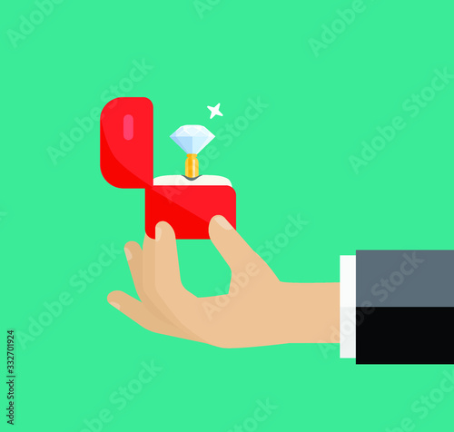Hand holding box with engagement ring . Marriage proposal 