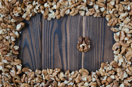 Walnuts on dark wooden background