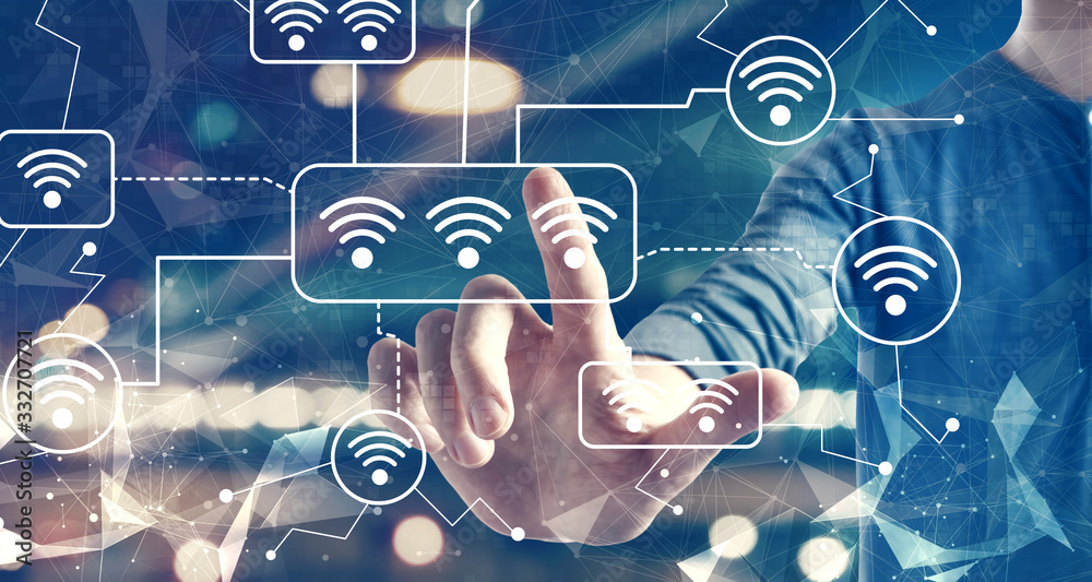 Wifi theme with a man on blurred city background Wifi theme with a man on blurred city background
