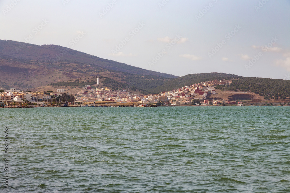 View of the coast in Nador in sunny day. Is a coastal city and provincial capital in the northeastern Rif region in Morocco. It is separated from the Mediterranean Sea by a Mar Chica lagoon. View of the coast in Nador in sunny day. Is a coastal city and provincial capital in the northeastern Rif region in Morocco. It is separated from the Mediterranean Sea by a Mar Chica lagoon.