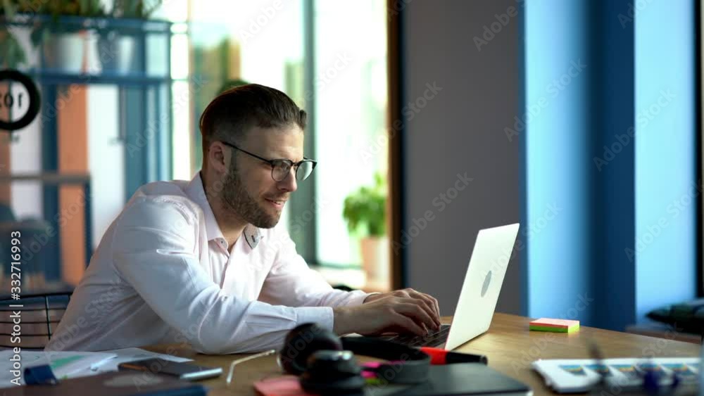 Inspired male blogger in classic spectacles for vision protection using computer technology for create interesting content publication and share to social people, talented smart casual freelancer Inspired male blogger in classic spectacles for vision protection using computer technology for create interesting content publication and share to social people, talented smart casual freelancer