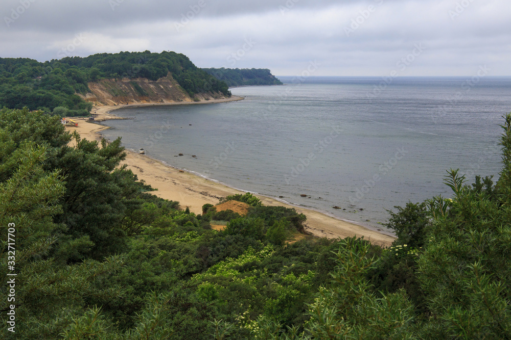 View of the cliffs and a beautiful cove on the Baltic Sea. View of the cliffs and a beautiful cove on the Baltic Sea.