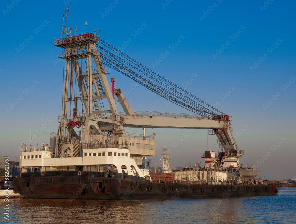 Heavy sea crane at the pier