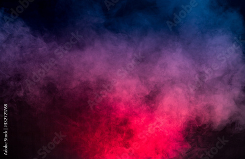 colorful smoke on dark background © kongrit