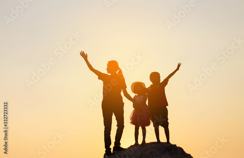 silhouette of a happy children and happy time sunset