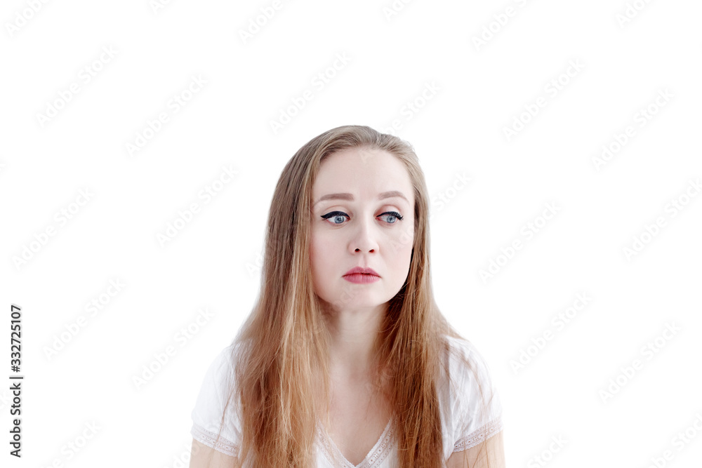 Sad young caucasian woman with unhappy facial expression, isolated on white background