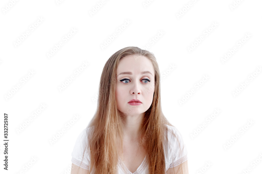 Sad young caucasian woman with unhappy facial expression, isolated on white background Sad young caucasian woman with unhappy facial expression, isolated on white background