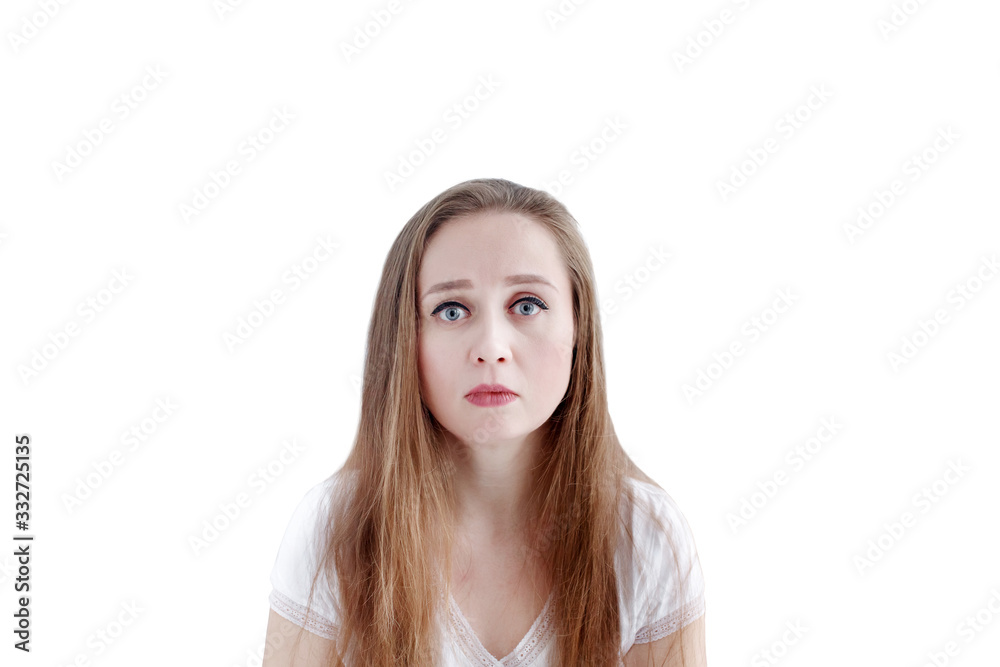 Sad young caucasian woman with unhappy facial expression, isolated on white background, close-up portrait