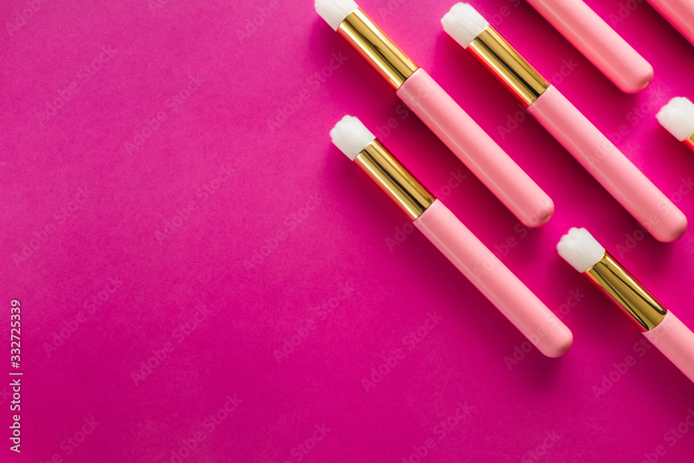 Cosmetics Brushes Arranged on Magenta Background Cosmetics Brushes Arranged on Magenta Background