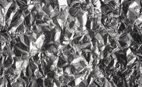 Aluminum crumpled foil, Pattern background with high-resolution design for book cover or brochure, poster, wallpaper or realistic business. Silver texture background, polished metal steel