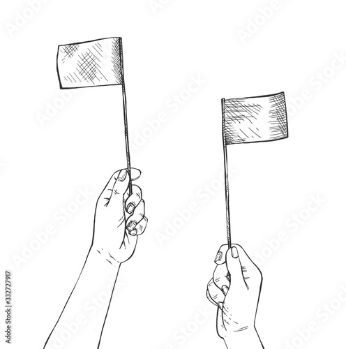 Human hands waving two small flags
