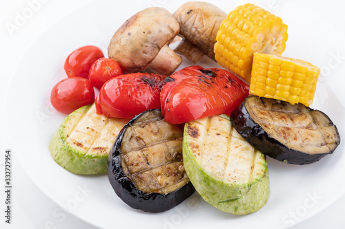 Plate with Grilled vegetables isolated on white background