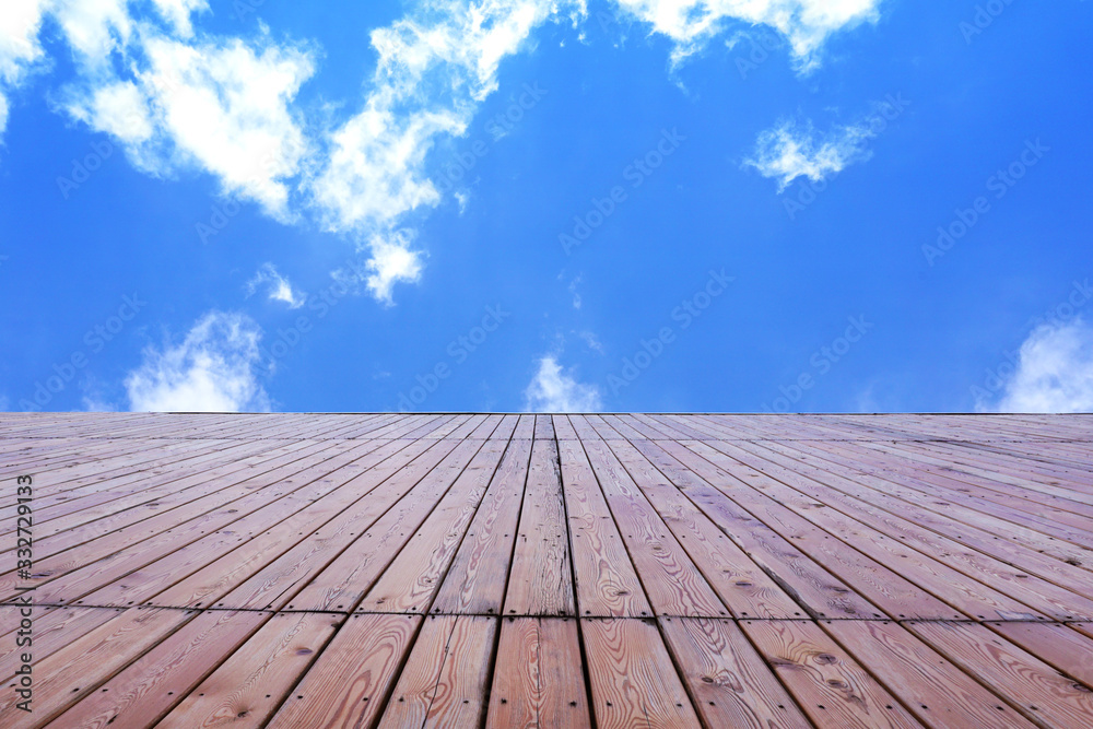 Wooden wall on blue sky