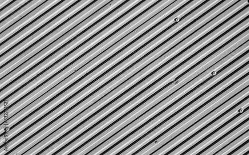 Metal plate wall in black and white.