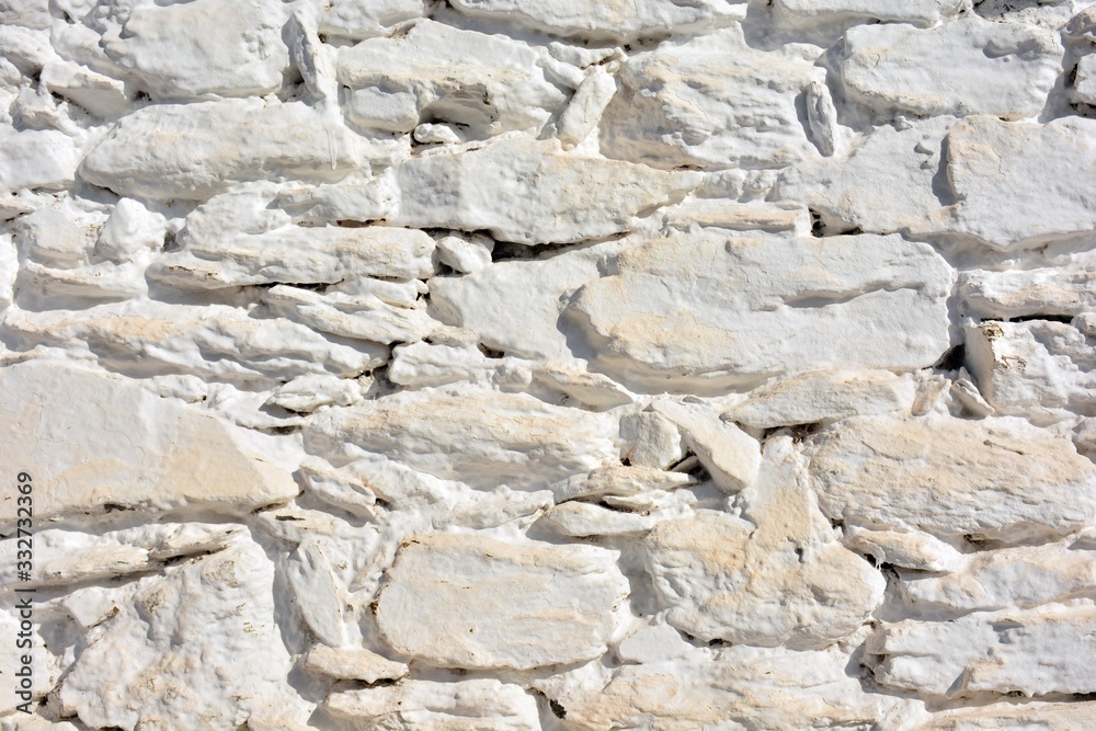 Textura de un muro hecho con piedras pintadas de blanco en la Alpujarra de Granada, España Textura de un muro hecho con piedras pintadas de blanco en la Alpujarra de Granada, España