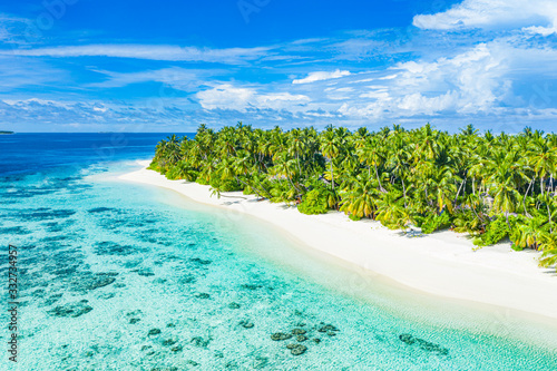 Fototapeta Naklejka Na Ścianę i Meble -  Tranquil aerial photo of beautiful paradise island beach in Maldives tropical beach on exotic island. Summer and travel vacation concept.