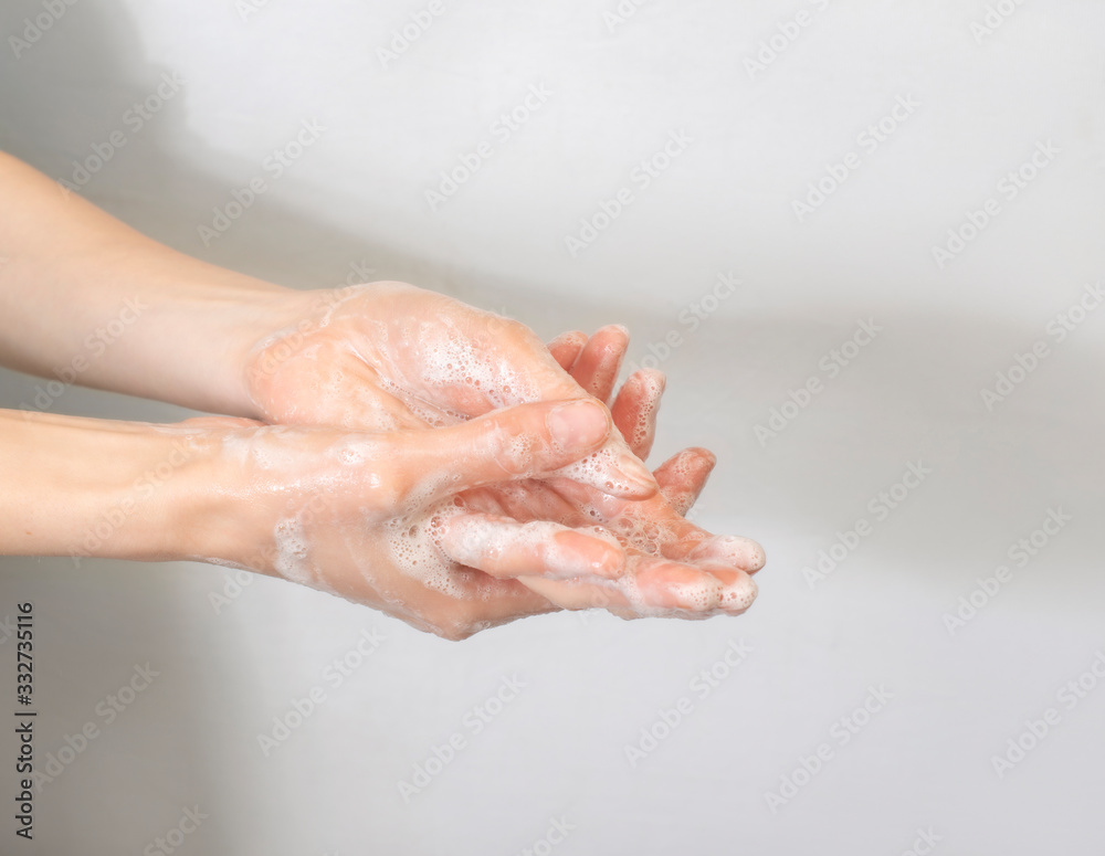 These are soapy female hands. These are soapy female hands.