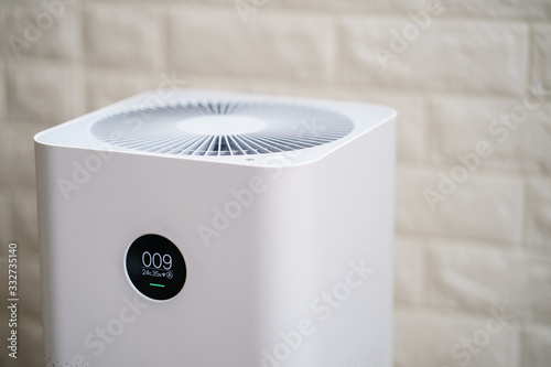 Closeup of  Air purifier with monitor screen, show air quality in the room. PM2.5 concept.