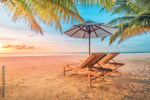 Sunset tropical beach landscape. White sand and coco palms wide panorama background concept. Amazing beach sunset use for summer vacation and exotic holiday  luxury travel tourism destination