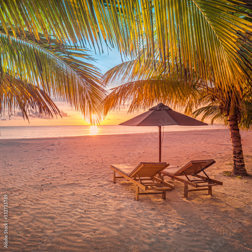 Sunset tropical beach landscape. White sand and coco palms wide panorama background concept. Amazing beach sunset use for summer vacation and exotic holiday, luxury travel tourism destination