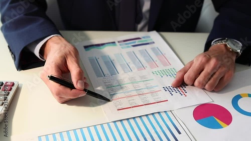 Bank manager working at table, closeup