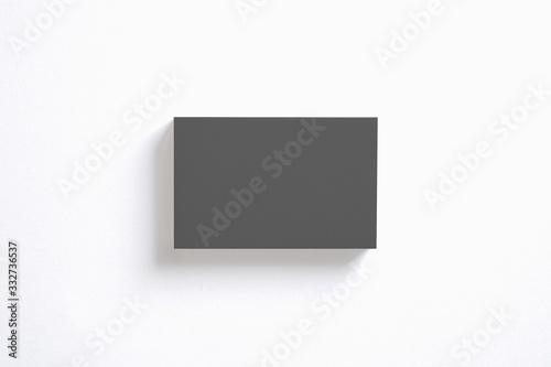 Blank black business cards stack isolated on white top view as template for design presentation, promotion etc.