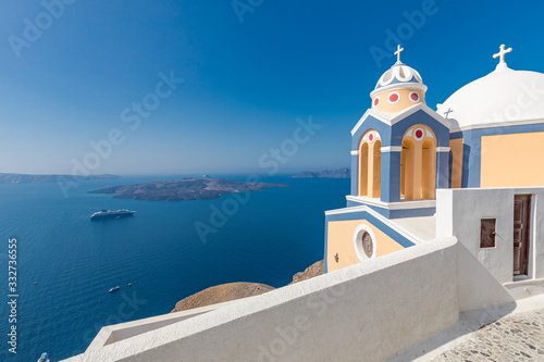 Beautiful church in Santorini, Greece with sea view in the background. Summer travel and vacation landscape. Amazing holiday destination concept