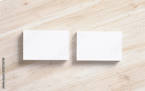 Blank business card stacks on wooden desk backround top view as template for design presentation, promotion etc.