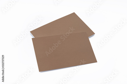 Blank cardboard business cards isolated on white as template for design presentation, promotion etc.