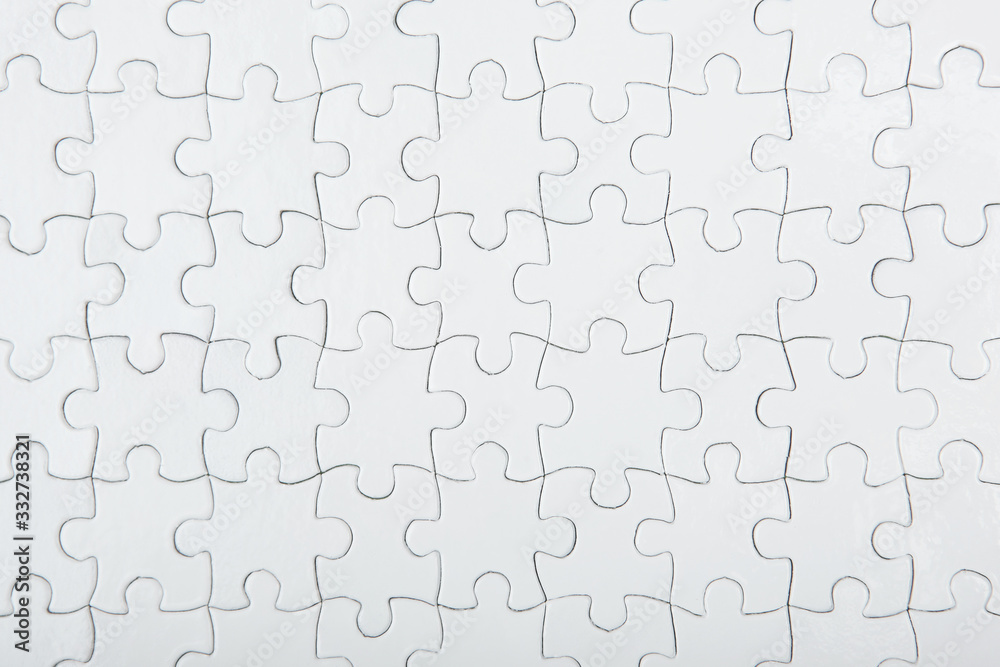 White puzzle on a colored background top view.