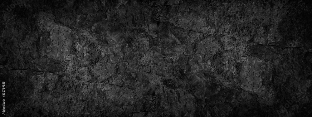 Black grunge background. Texture of cracked stone surface. Black rock grunge background with copy space for your design.