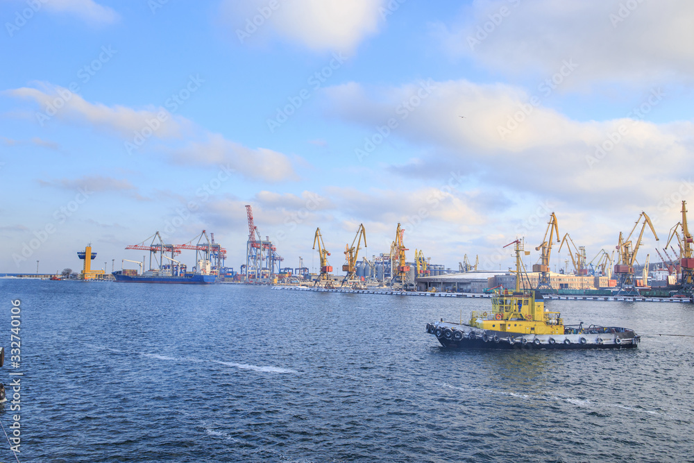 Tugboat sailing in port in winter