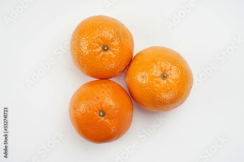 Ripe oranges isolated on a light background