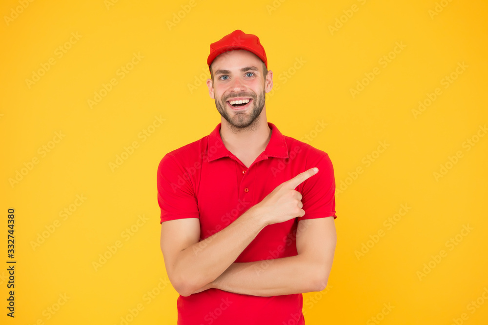 Special offer copy space. Shop worker. Handsome guy cashier. Staff wanted. Supermarket cashier. Man delivery service wear red cap. Shop assistant. Food order delivery man. Cashier occupation