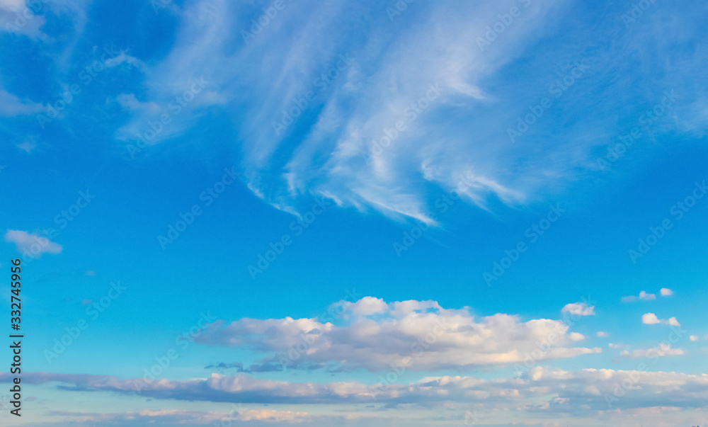 Light blue sky with white clouds of different strange shape_ Light blue sky with white clouds of different strange shape_