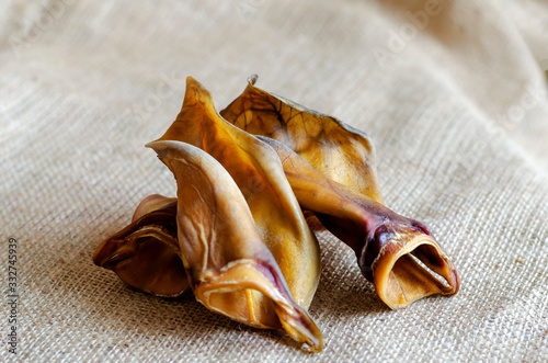 Dried beef ears on burlap.