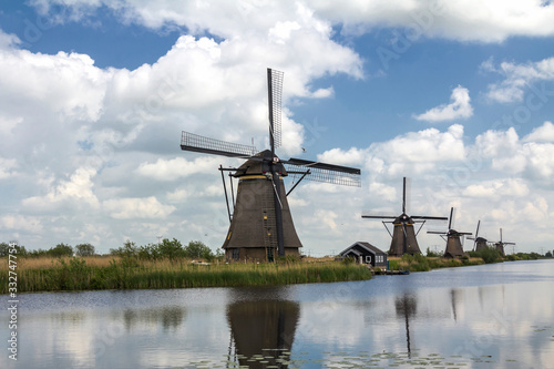 Kinderdijk, Rotterdam, NETHERLANDS: Netherlands rural lanscape with windmills at famous tourist site Kinderdijk in Holland. Old Dutch village Kinderdijk, UNESCO world heritage site.	