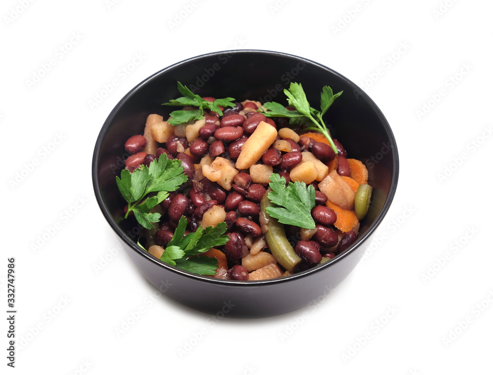 Vegan low calorie lettuce with baked beans with carrots and greens in black round bowl studio shot isolated on white background front view Vegan low calorie lettuce with baked beans with carrots and greens in black round bowl studio shot isolated on white background front view