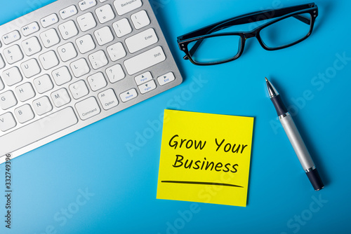 Grow Your Business - message on office workplace
