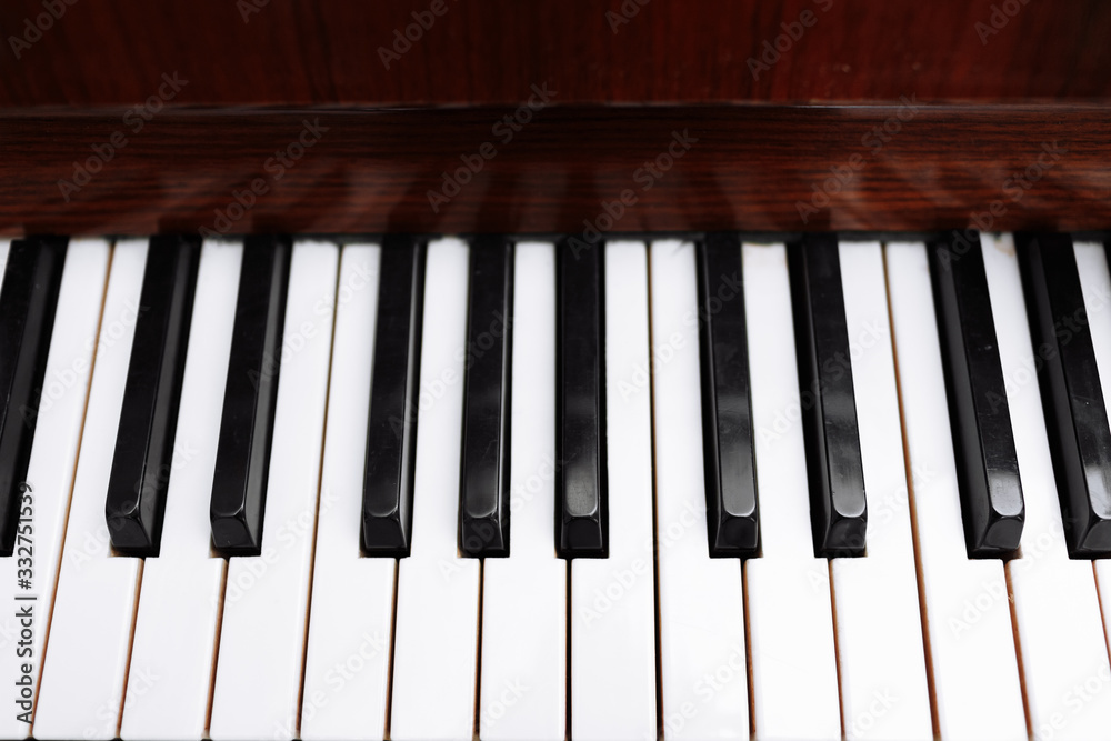 Piano keyboard, close up of keys. Black and white keys of a piano background Piano keyboard, close up of keys. Black and white keys of a piano background